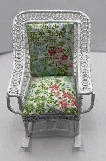 White Lawn Rocker with Green and Pink Cushions