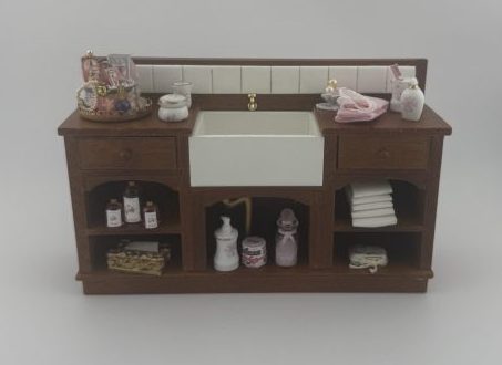 White Bathroom Sink in Walnut Cabinet