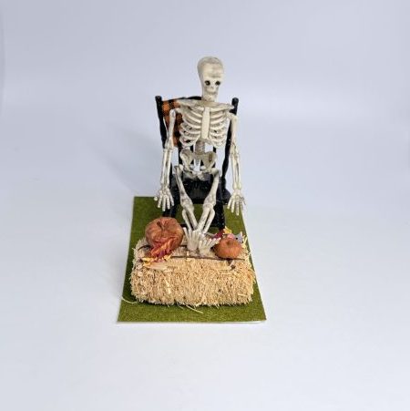 Skeleton Sitting Outside