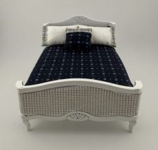 White Bed with Wicker Footboard